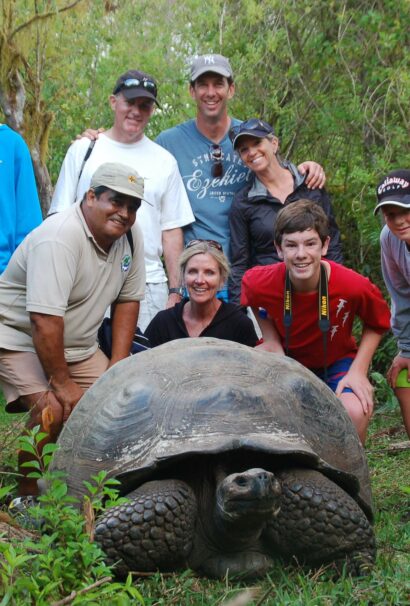 Group with Classic Journeys guide, Alfredo, and a giant land tortoise