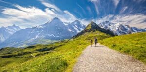 Couple hiking a trail in the Swiss Alps