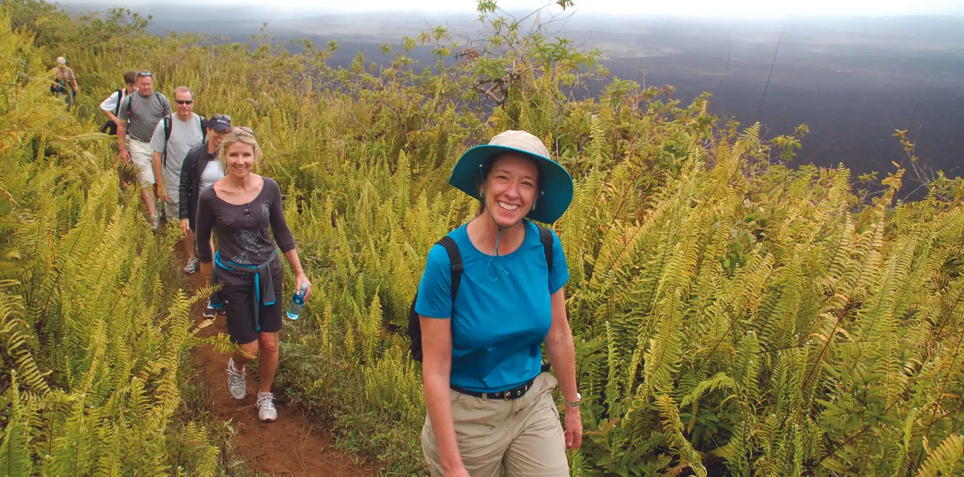 Travelers walking in the Galapagos Islands