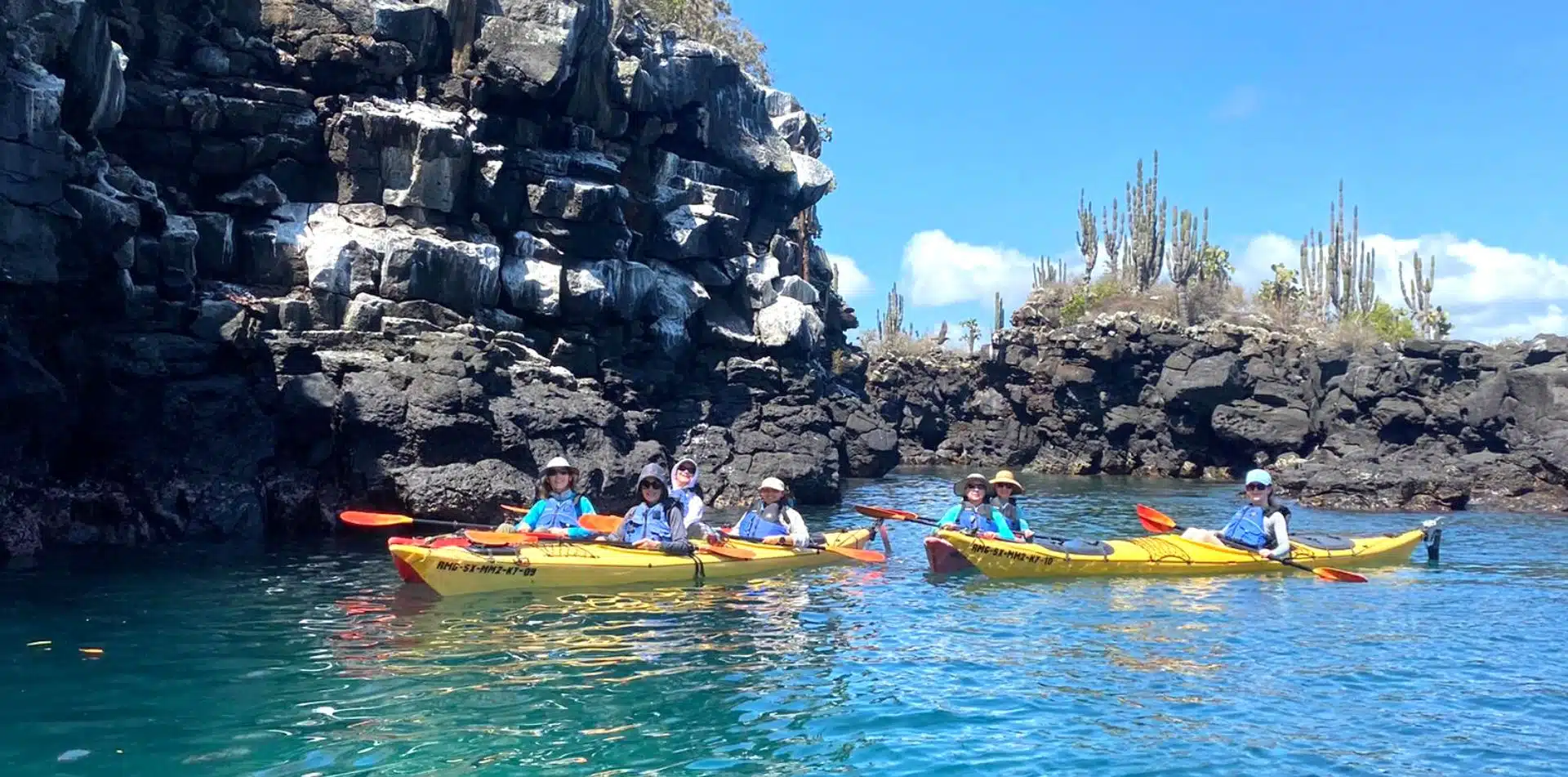 Travelers kayaking in the Galapagos Islands