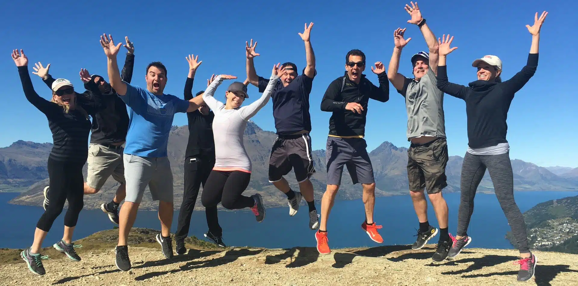 Travelers jumping for joy in New Zealand