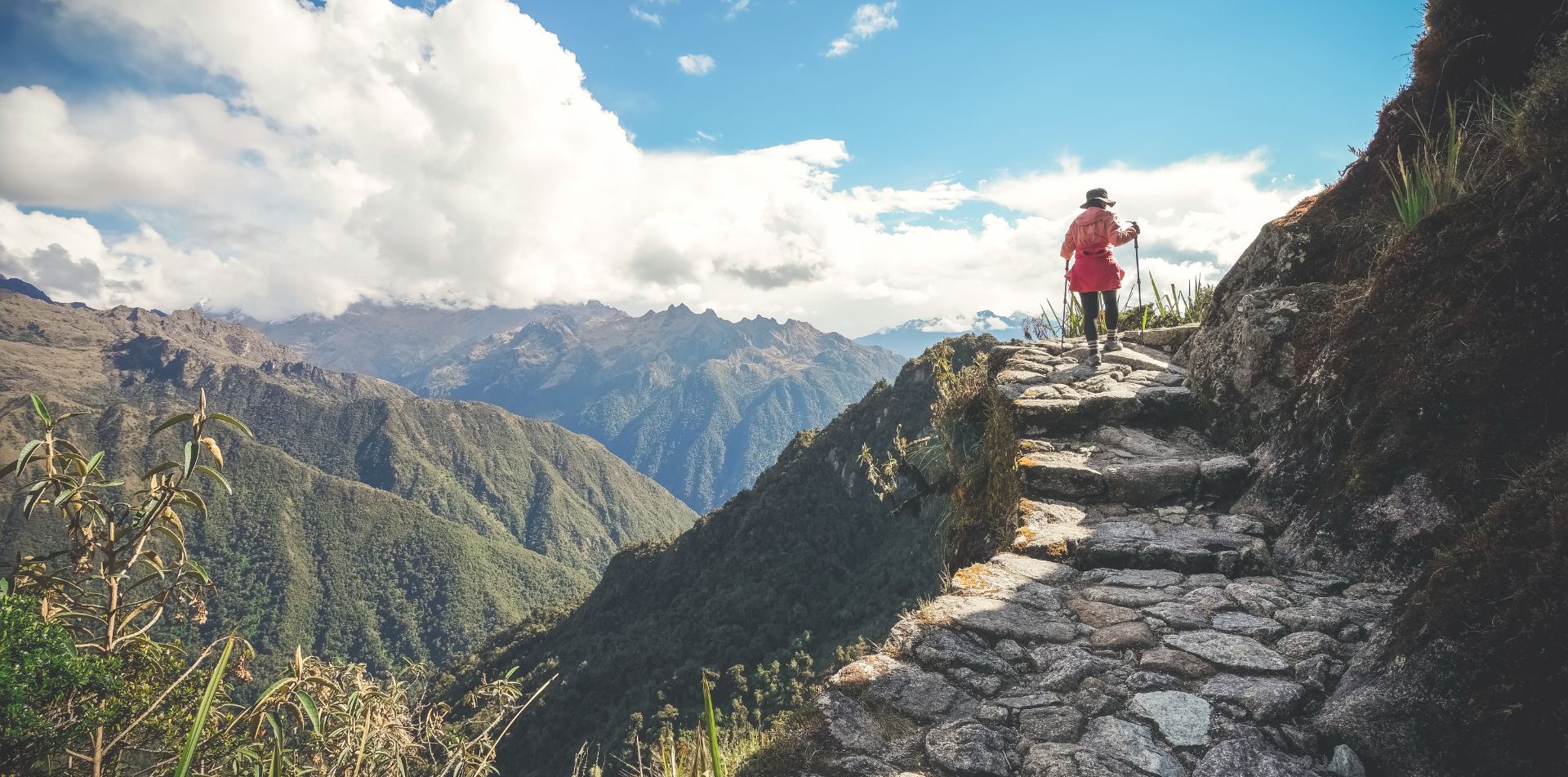 Traveler walking along a scenic path in Peru