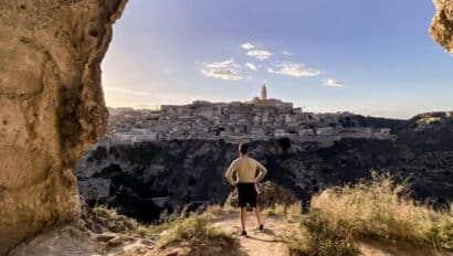 Italy Puglia man overlooking town