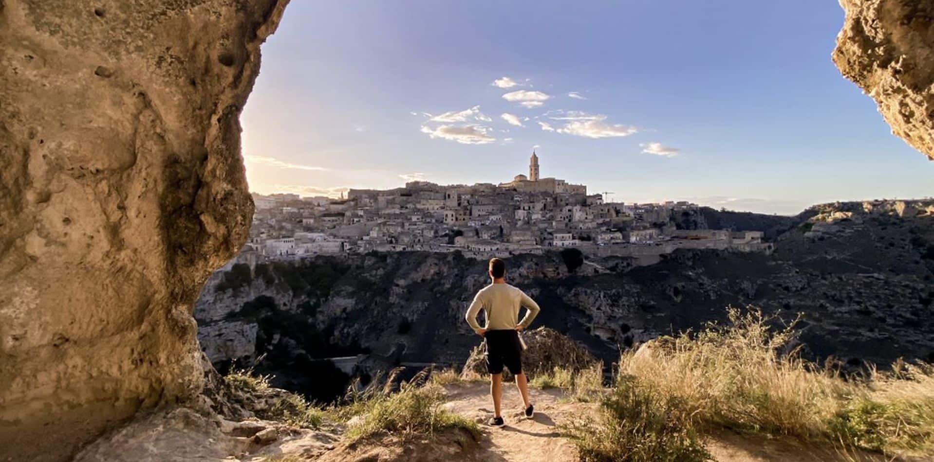 Italy Puglia man overlooking town