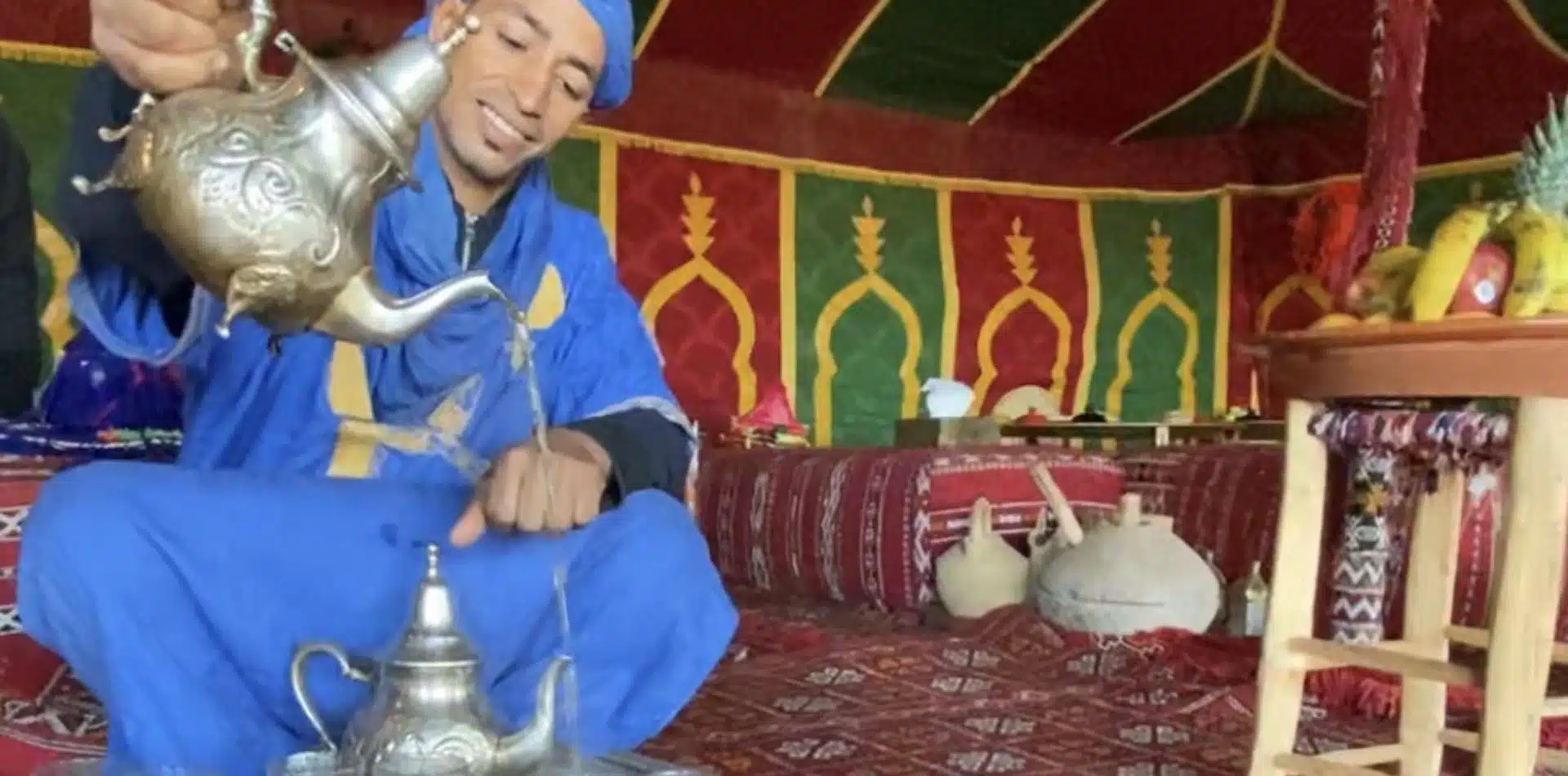 Classic Journeys' expert local guide pouring tea in Morocco