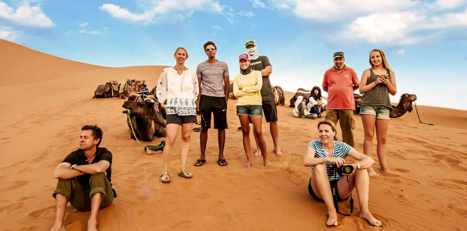 Travelers on sand dunes in Morocco