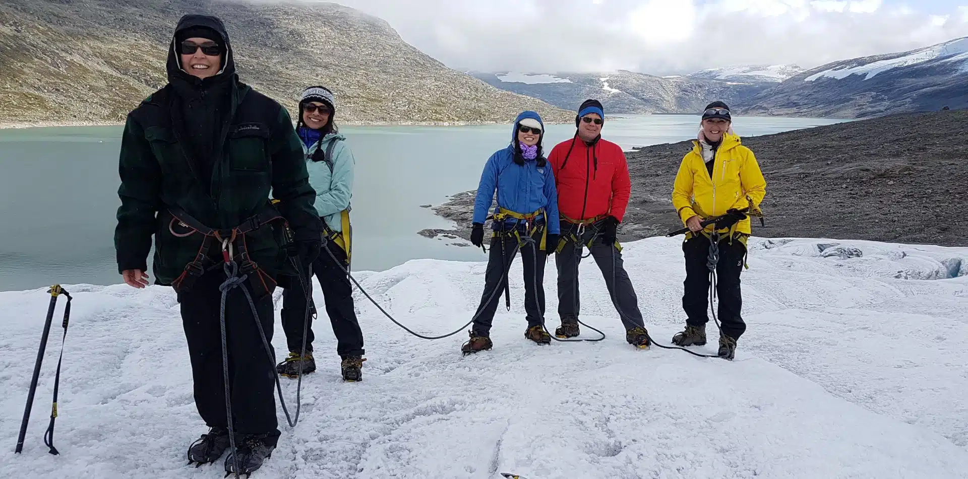 Travelers hiking on a glacier in Norway