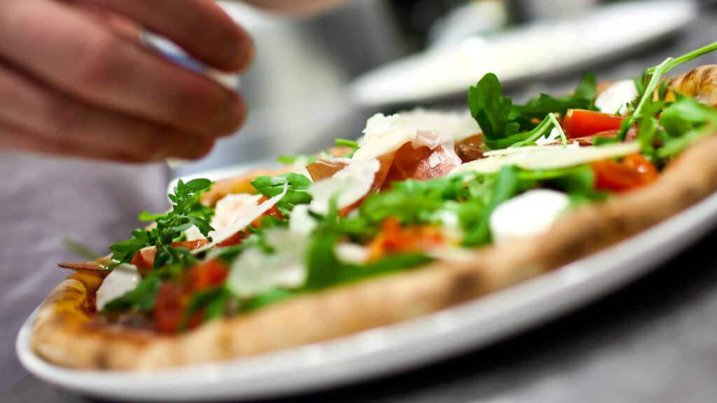 A pizza being made in Italy