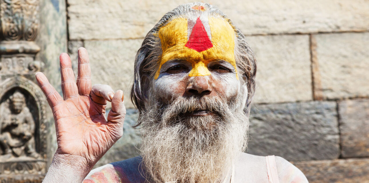 A man in Asia wearing traditional face makup.