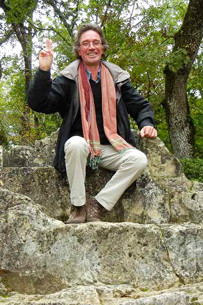 Bart tour guide sitting on a rock.