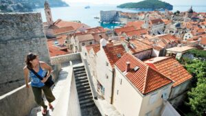 A woman walking up stairs in Croatia