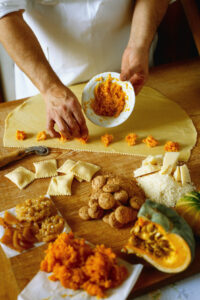 A chef preparing a spread of food