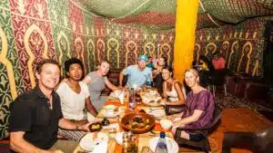 A group enjoying a meal in a tent.