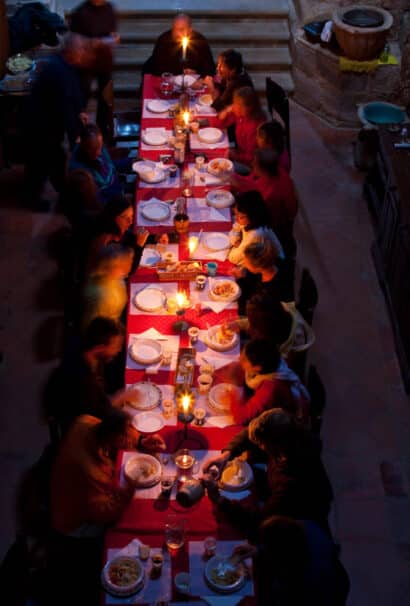 A group of people eating at a long table.