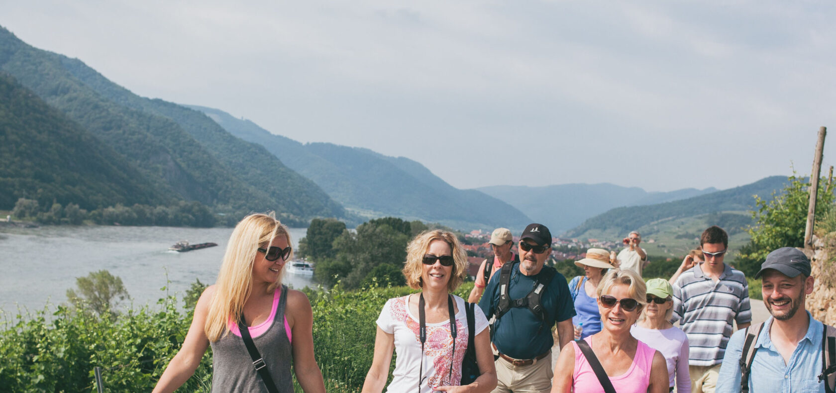 A group of a adults walking down a path.