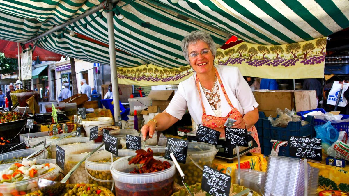 A woman selling goods in a market.