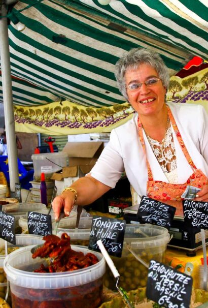 A woman selling goods in a market.