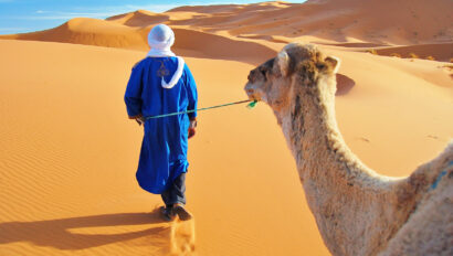 People walking with a camel in Morocco