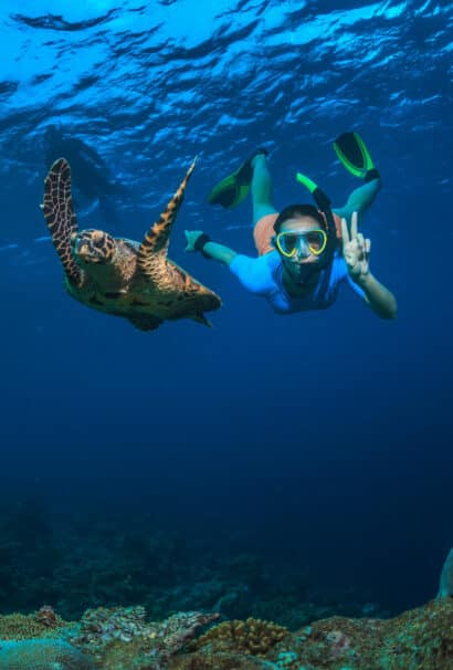 A young girl snorkeling.