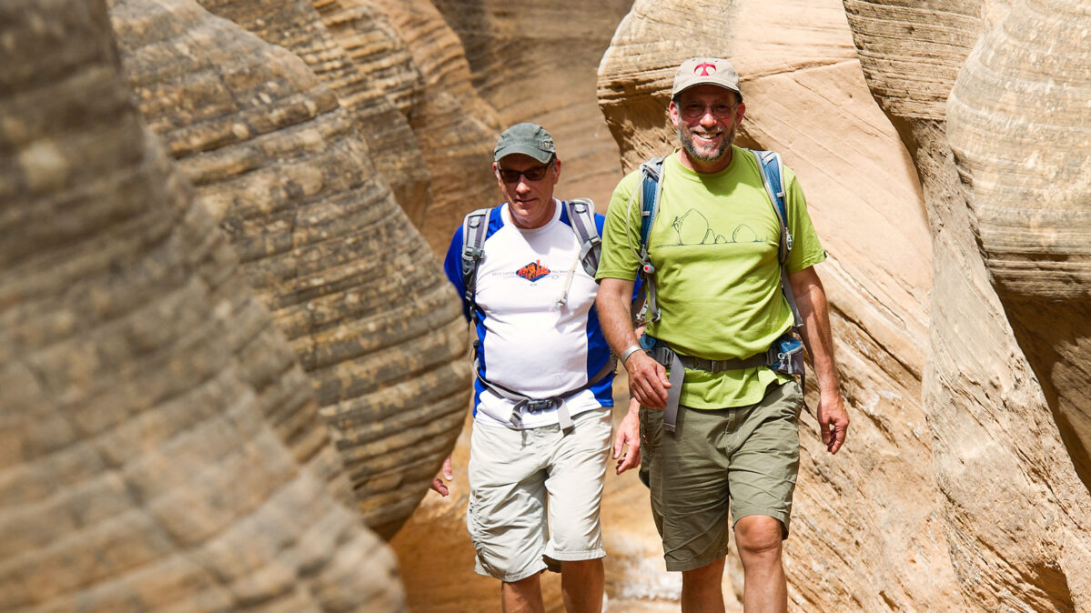 A guide leading a tour through a canyon.
