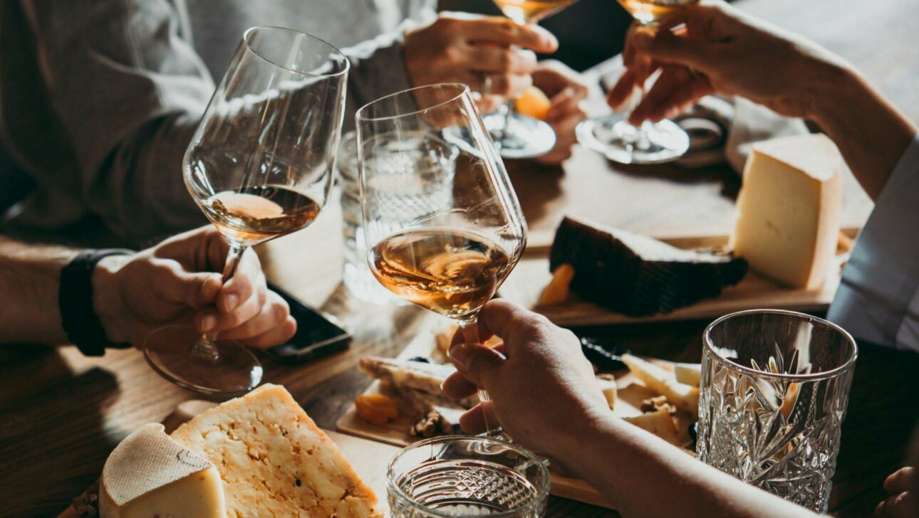 A group of people clinking glasses.