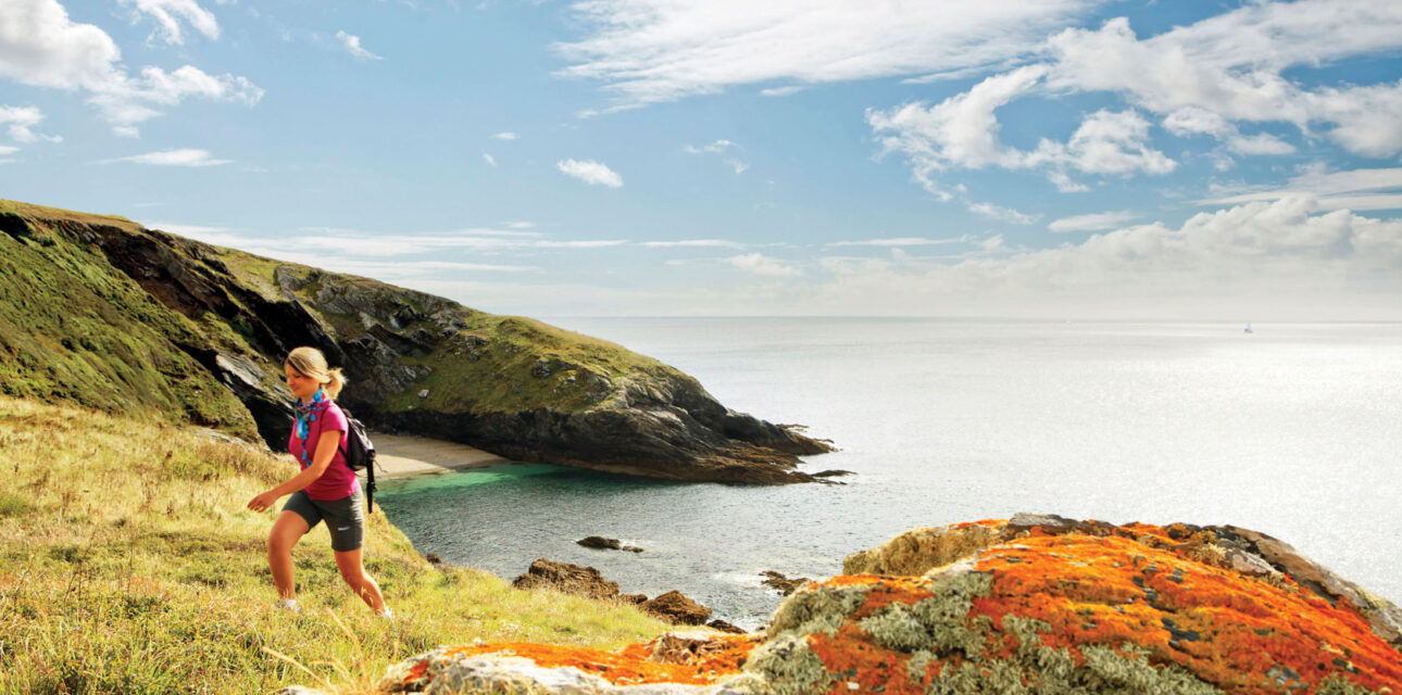 A woman climbing a hill in the UK.