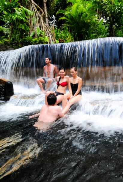 A family in a waterfall.