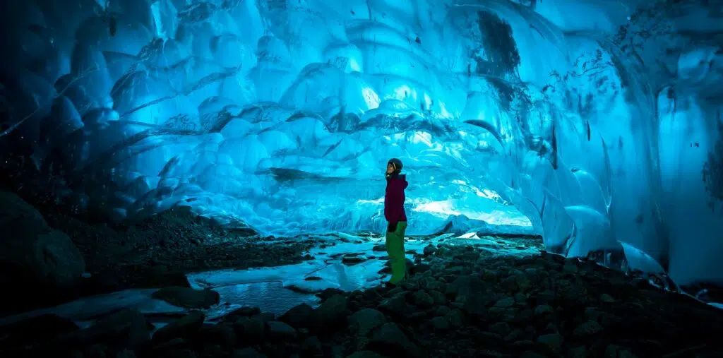 Traveler in an ice cave in Iceland