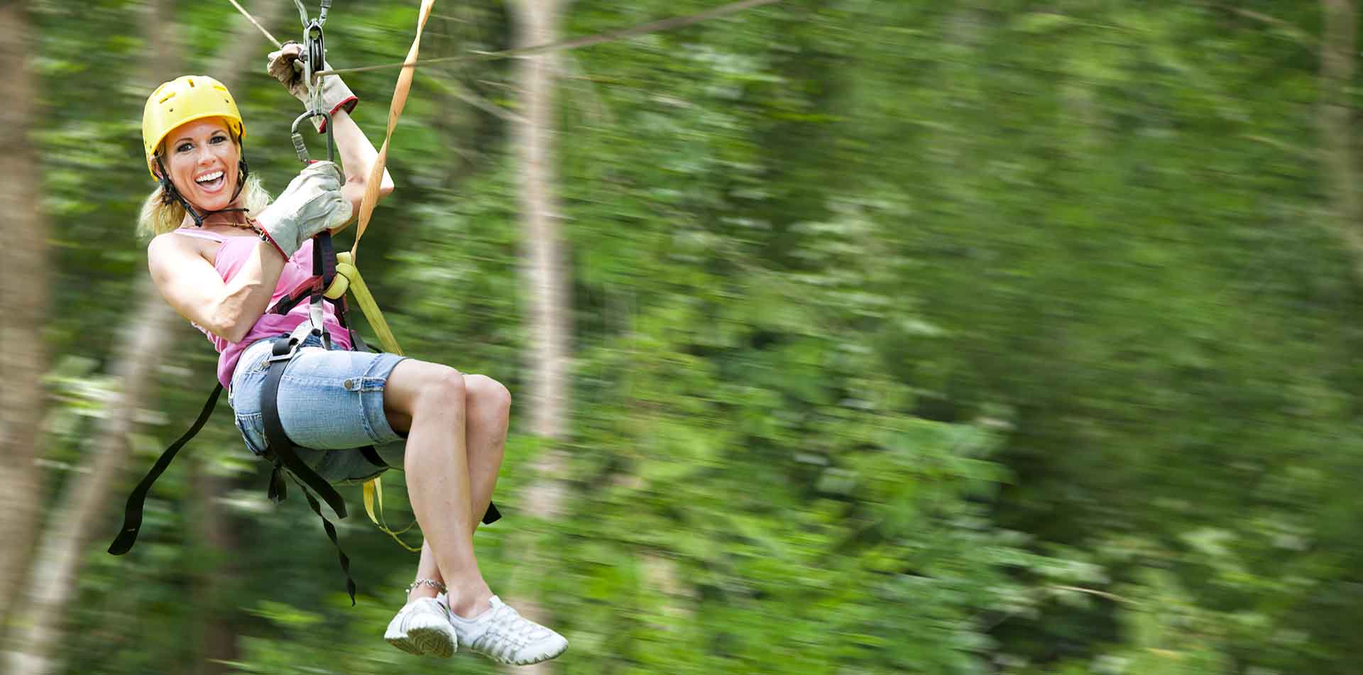 Woman ziplining through the jungles of Costa Rica