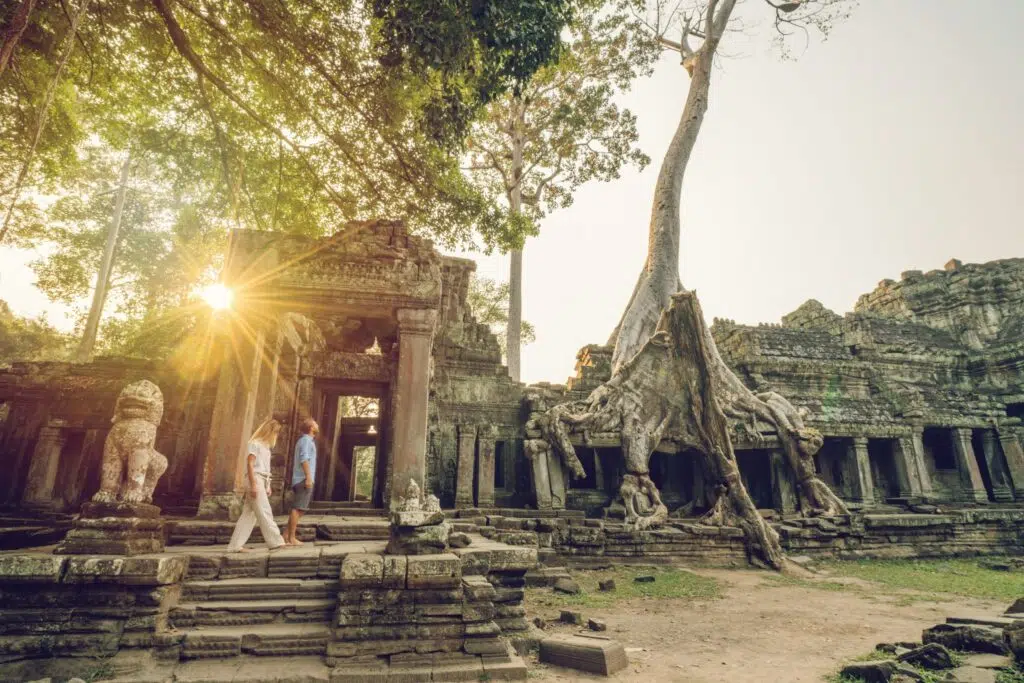 Couple strolling through the ruins of Angkor Wat Cambodia