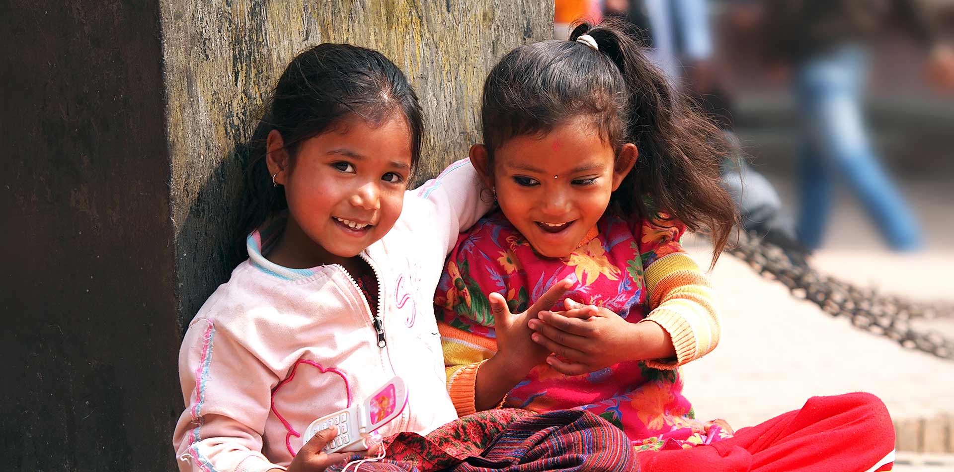 Kids sitting on street in Kathmandu