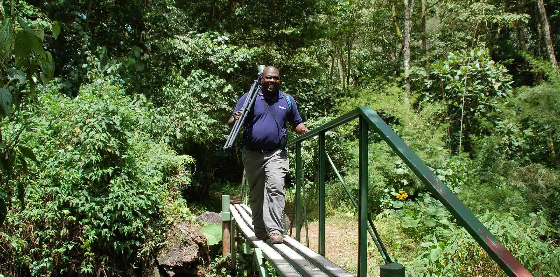 Classic Journeys' local guide walking on a bridge in Panama