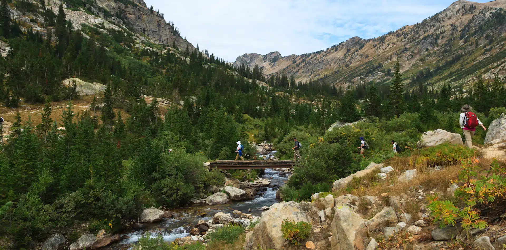 North America USA U.S. National Parks Wyoming Grand Teton Hikers Crossing Bridge Teton Canyon