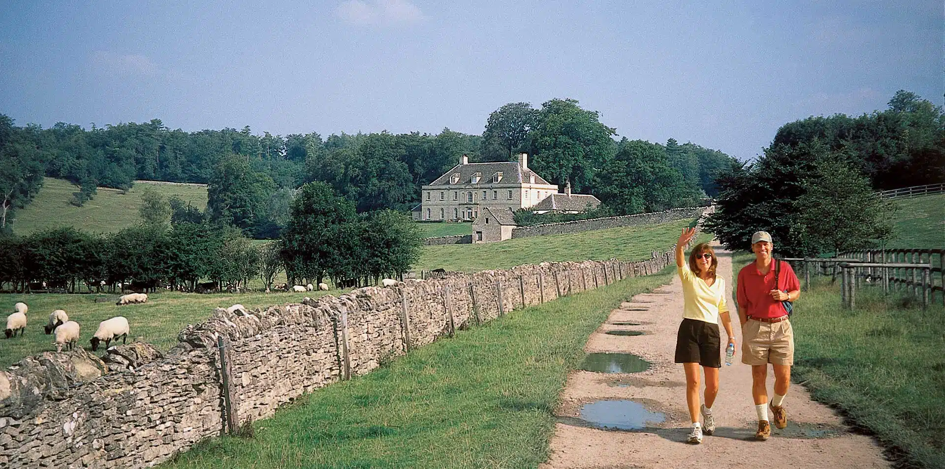 People Walking Through Cotswolds Countryside, England