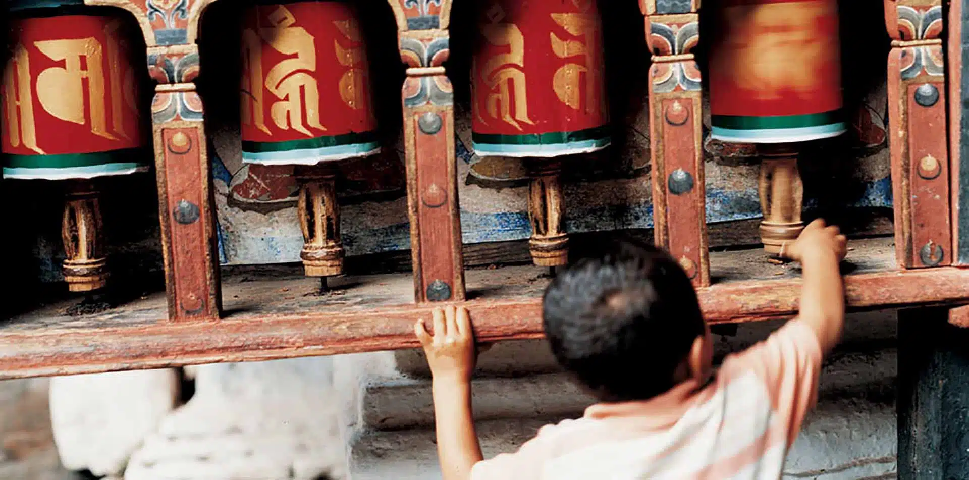 Young Boy with Prayer Wheels, Bhutan