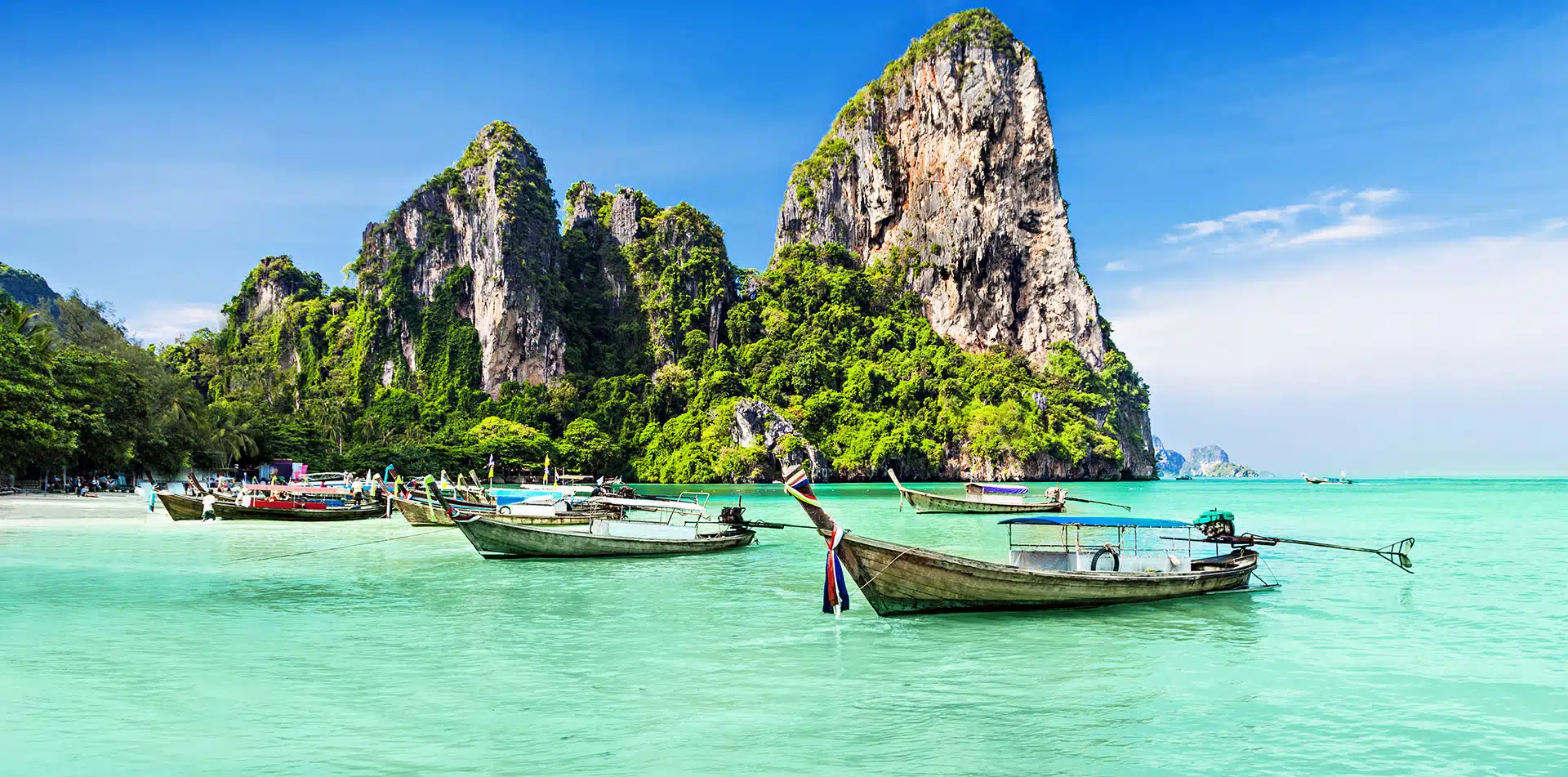 Longtale boats on beach in Phuket Thailand