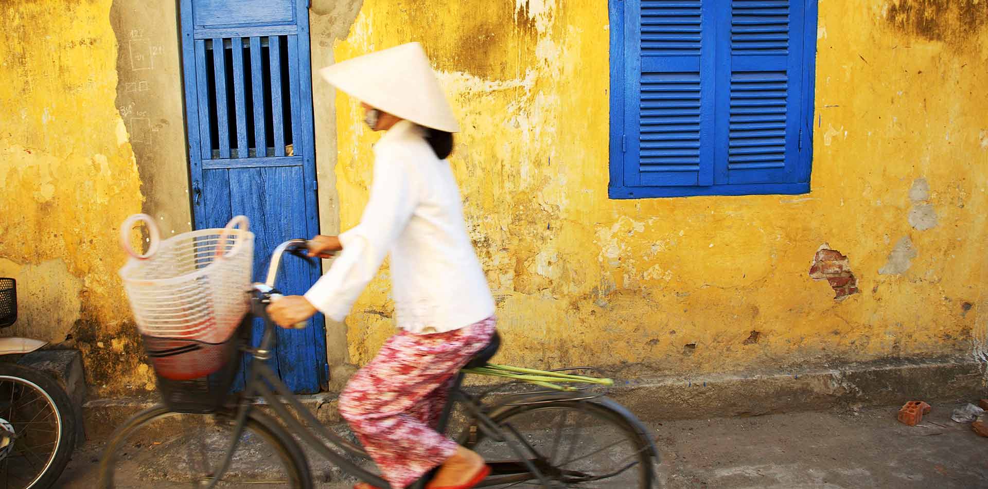 Woman on a Bicycle in Vietnam