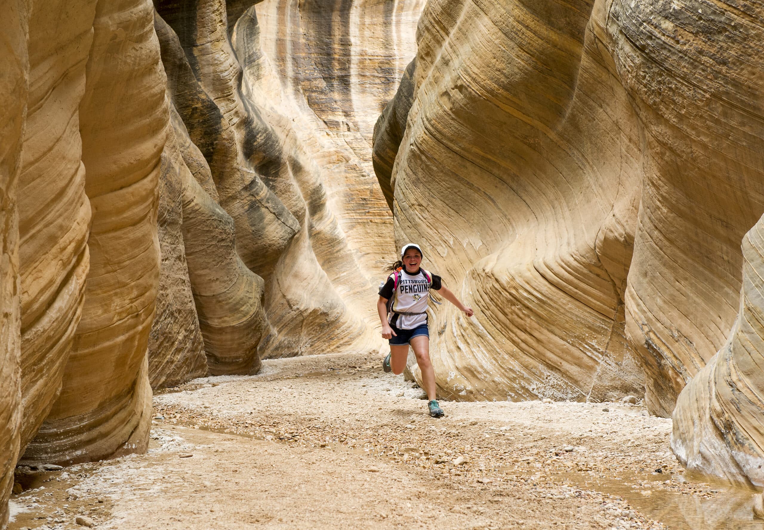 Girl running in Bryce Canyon