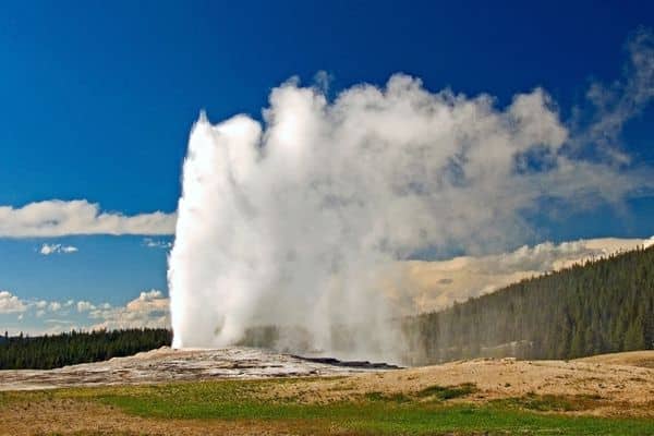 Old Faithful erupting in Yellowstone National Park