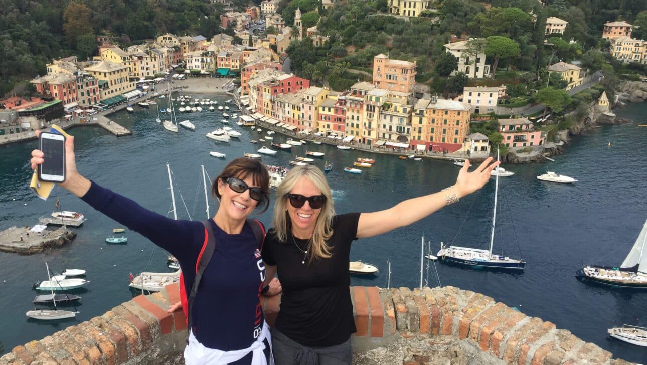 Women in Portofino waving from Castello