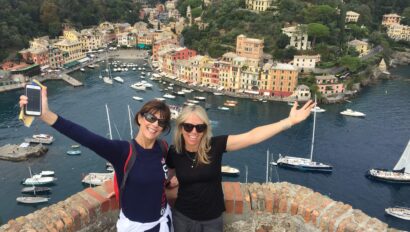 Women in Portofino waving from Castello