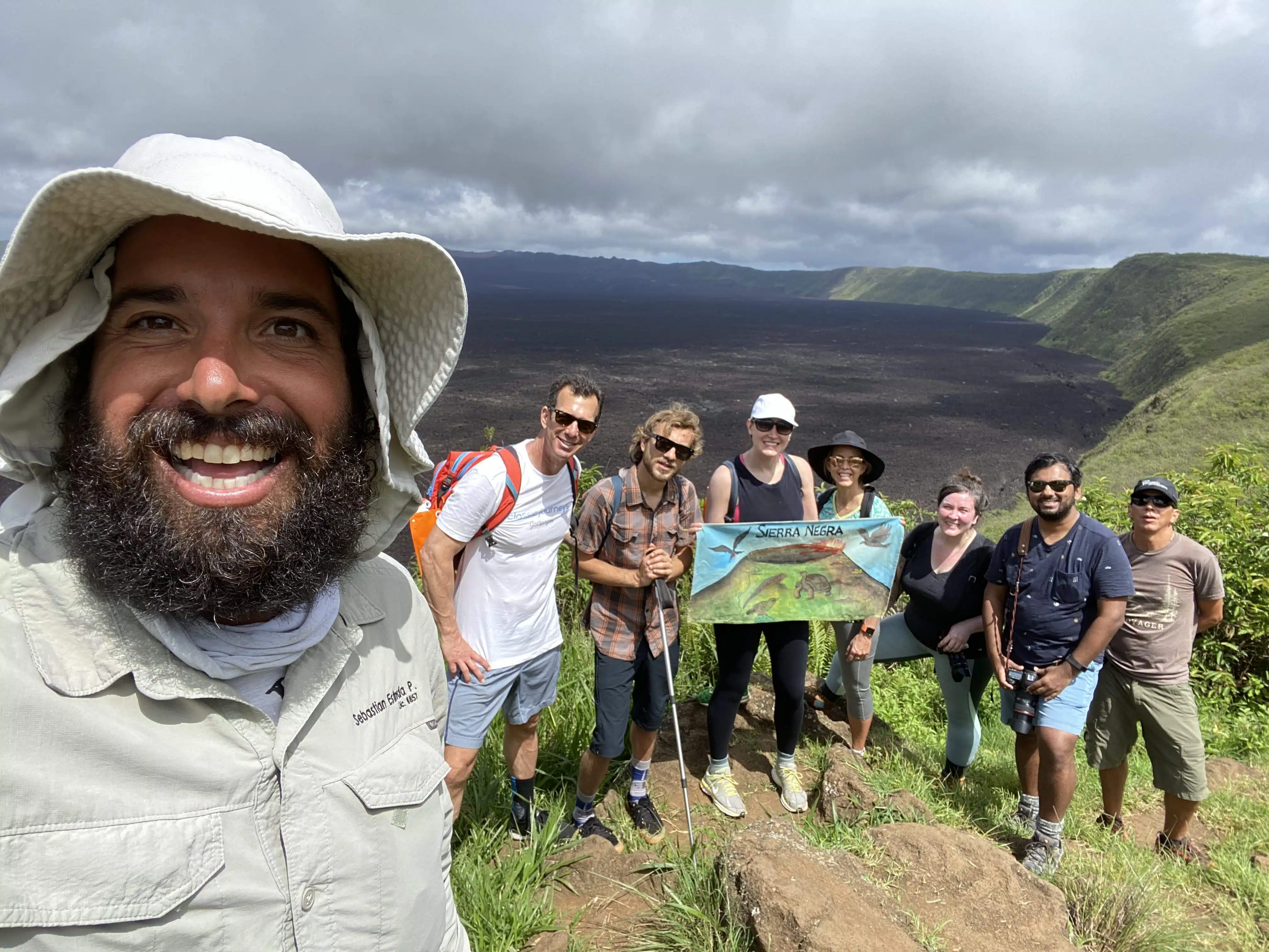 Naturalist guide and guests take a selfie in the Galapagos