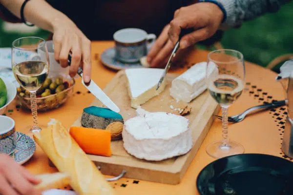 Group of travelers in Porto, Portugal sharing a cheese board