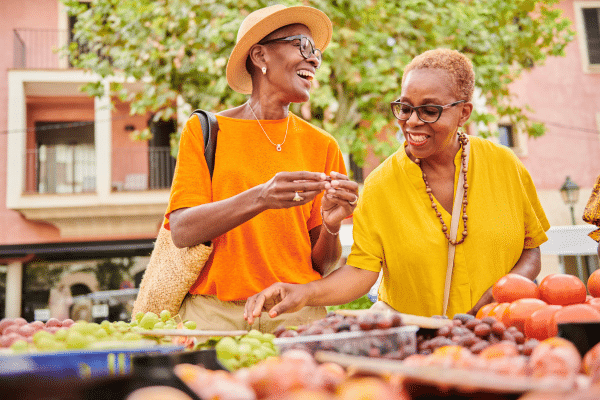 Female travelers enjoying the local market in Porto, Portugal