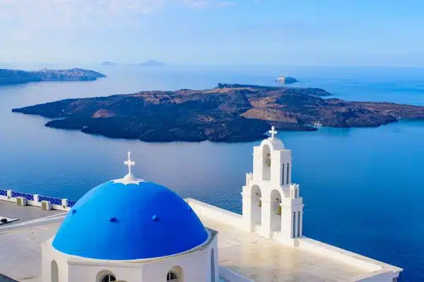 The famed Three Bells of Fira on the coast of Santorini, Greece