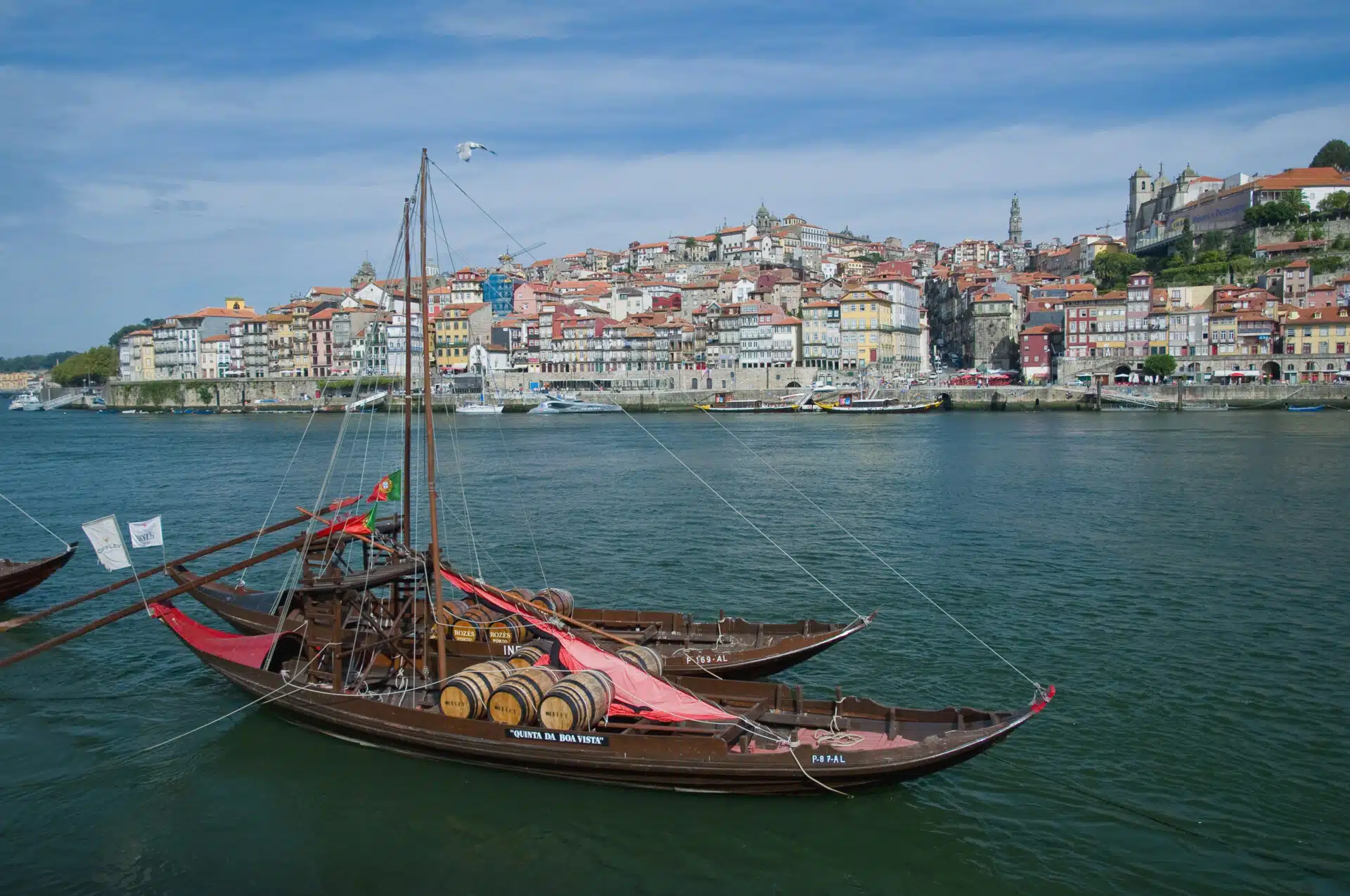 Rabelo boats, also called "sherry boats" on the Douro River at the Ribeira do Porto waterfront across from Oporto, Portugal. | Location: Porto, Portugal.