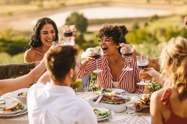 Group of travelers drinking Sicily's red Marsala wine