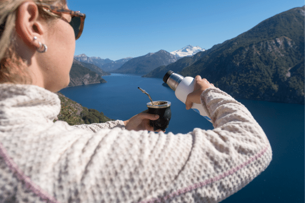 Enjoying yerba mate with mountains in background in Chile