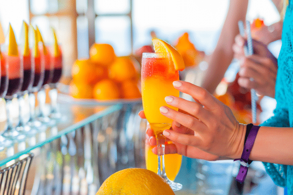 Traveler holding tropical fruit drink in the Galapagos