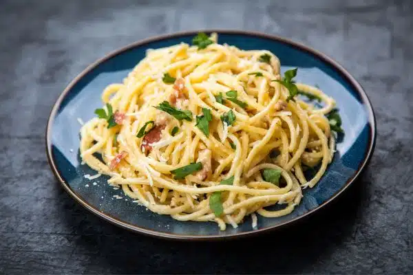 Dig in to a bowl of Spaghetti alla Carbonara, with pancetta and egg for creamy decadence